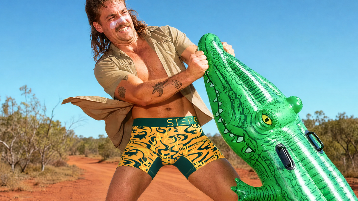 Close-up of the Crocz print: green crocodiles on yellow bamboo viscose